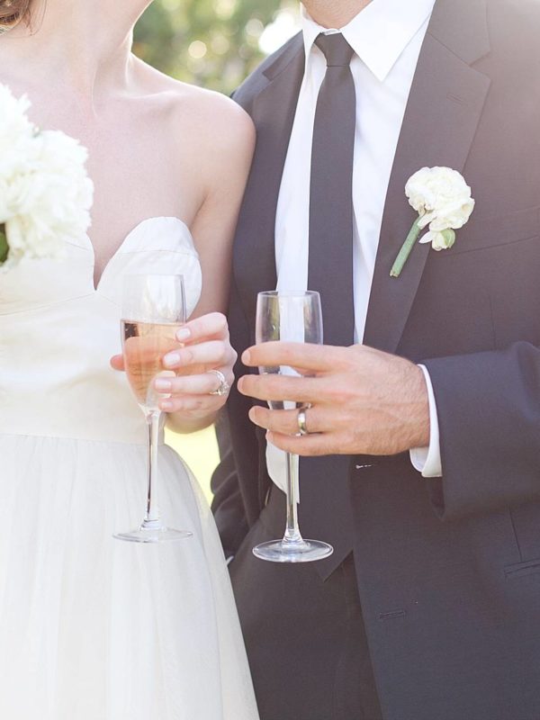 bride and groom toast with champagne