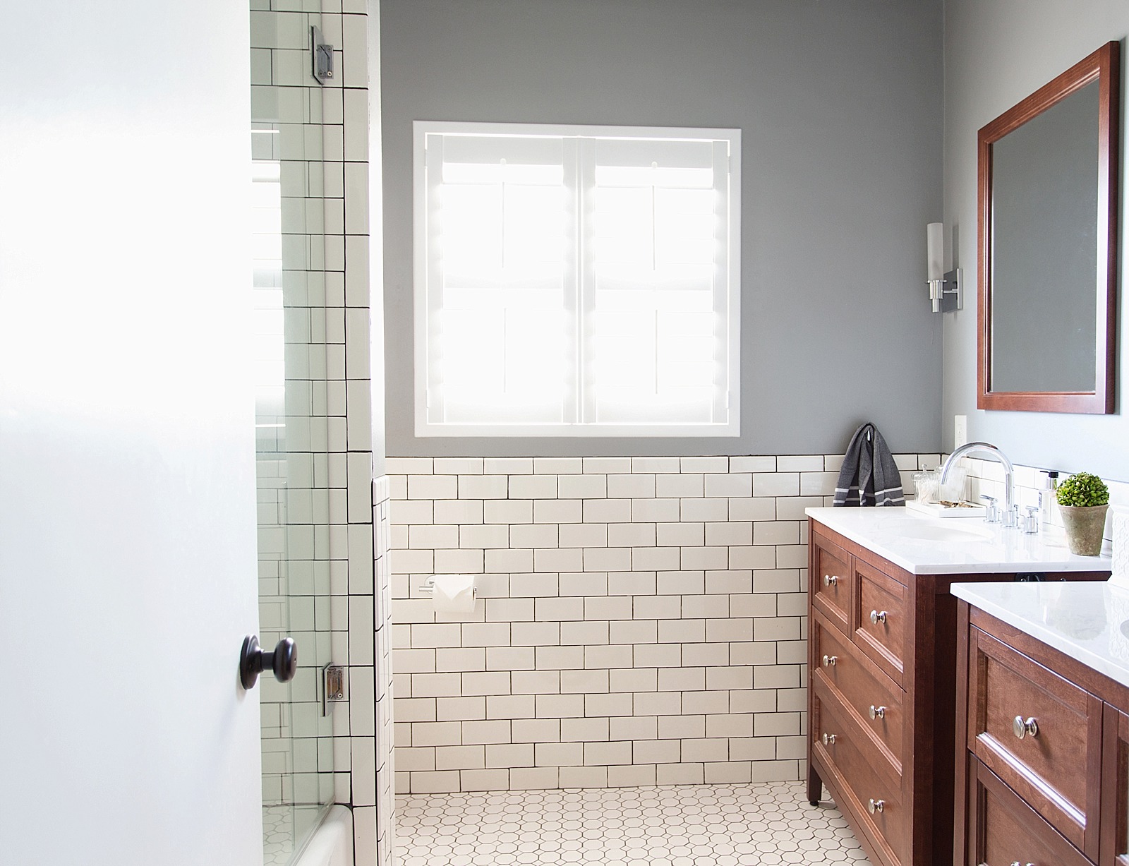 white subway tile with dark black grout bathroom jonathan adler touches zebra rug and bathroom refresh home tour belonging to diana elizabeth, lifestyle blogger