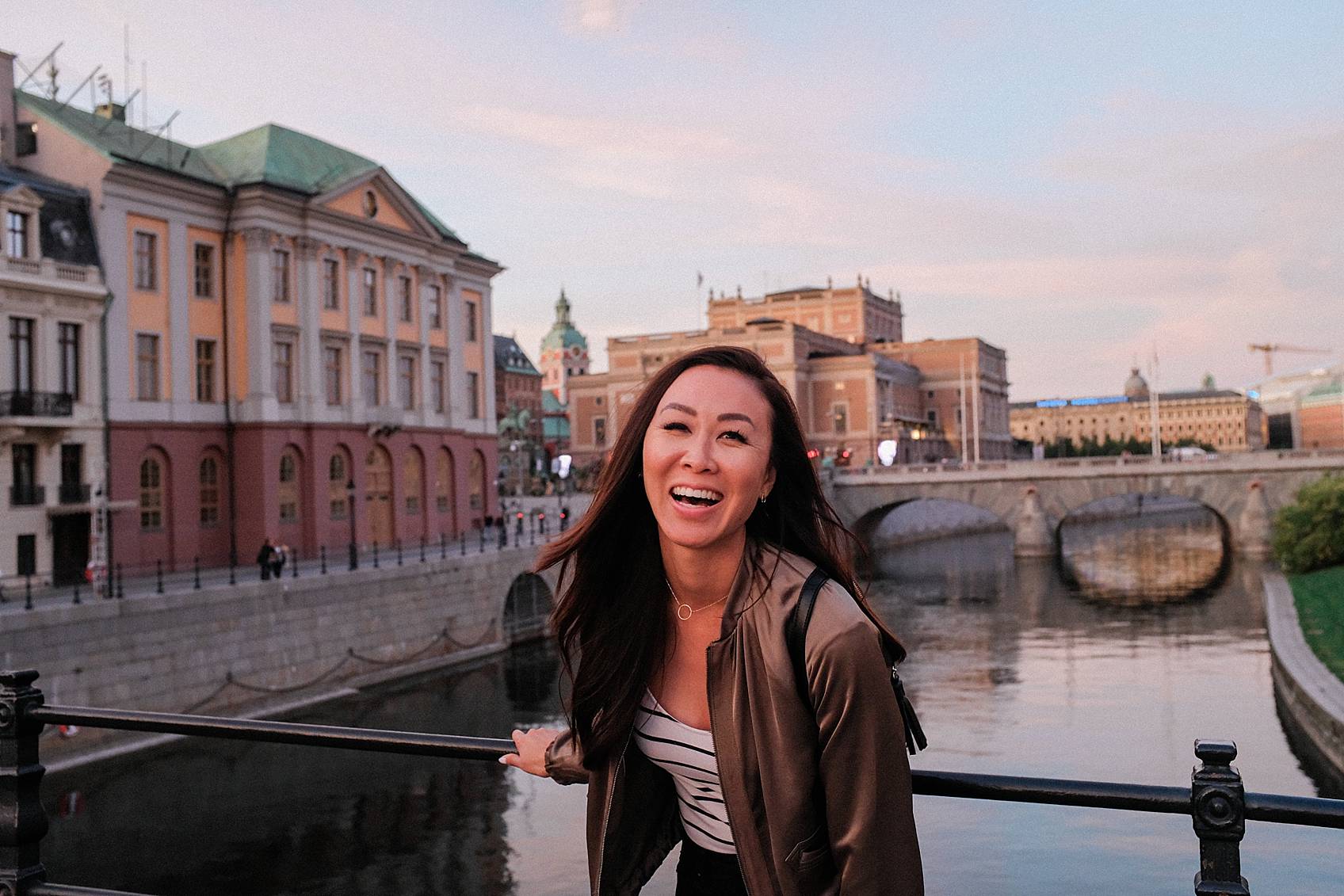 Photo tour of Stockholm: walking around laughing at bridge at sunset