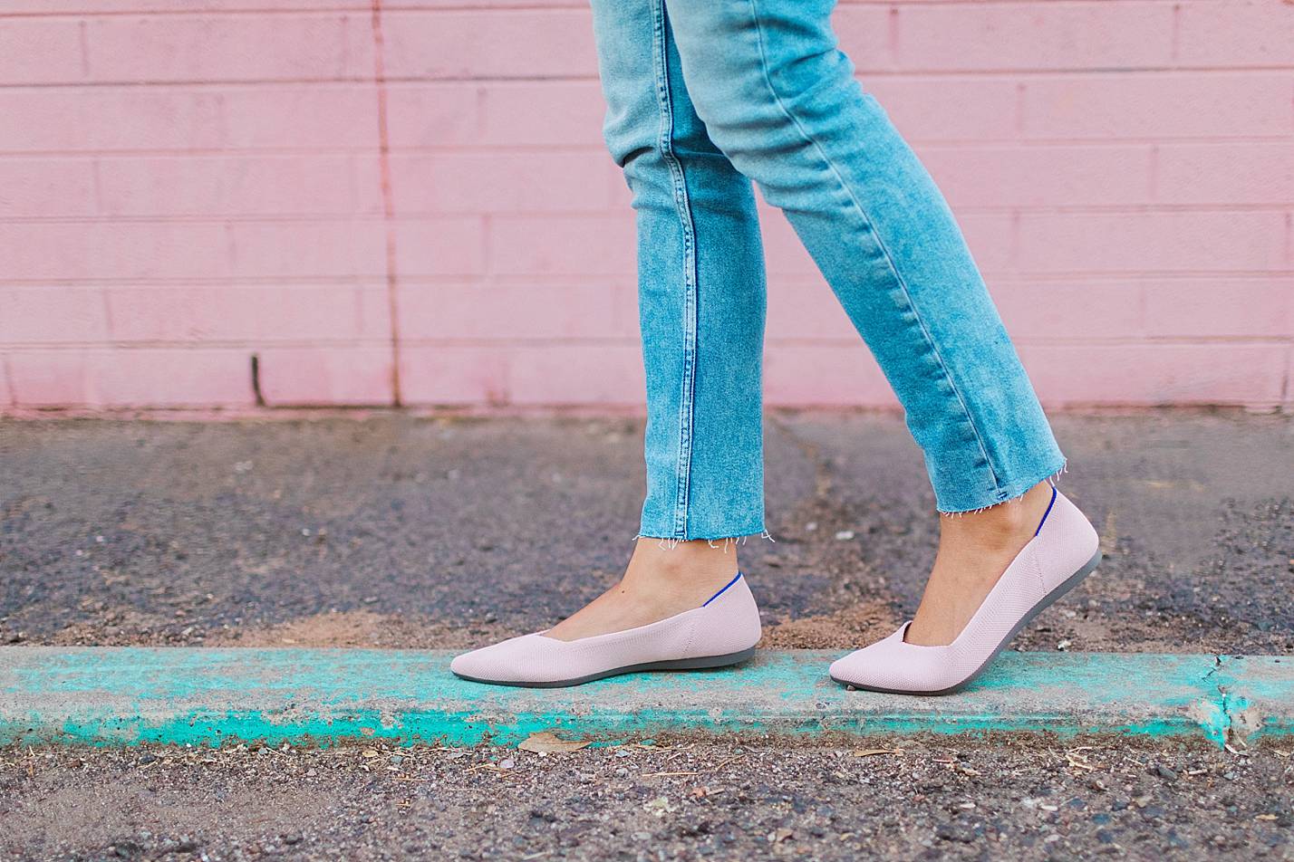 pink flats by rothy's pink wall