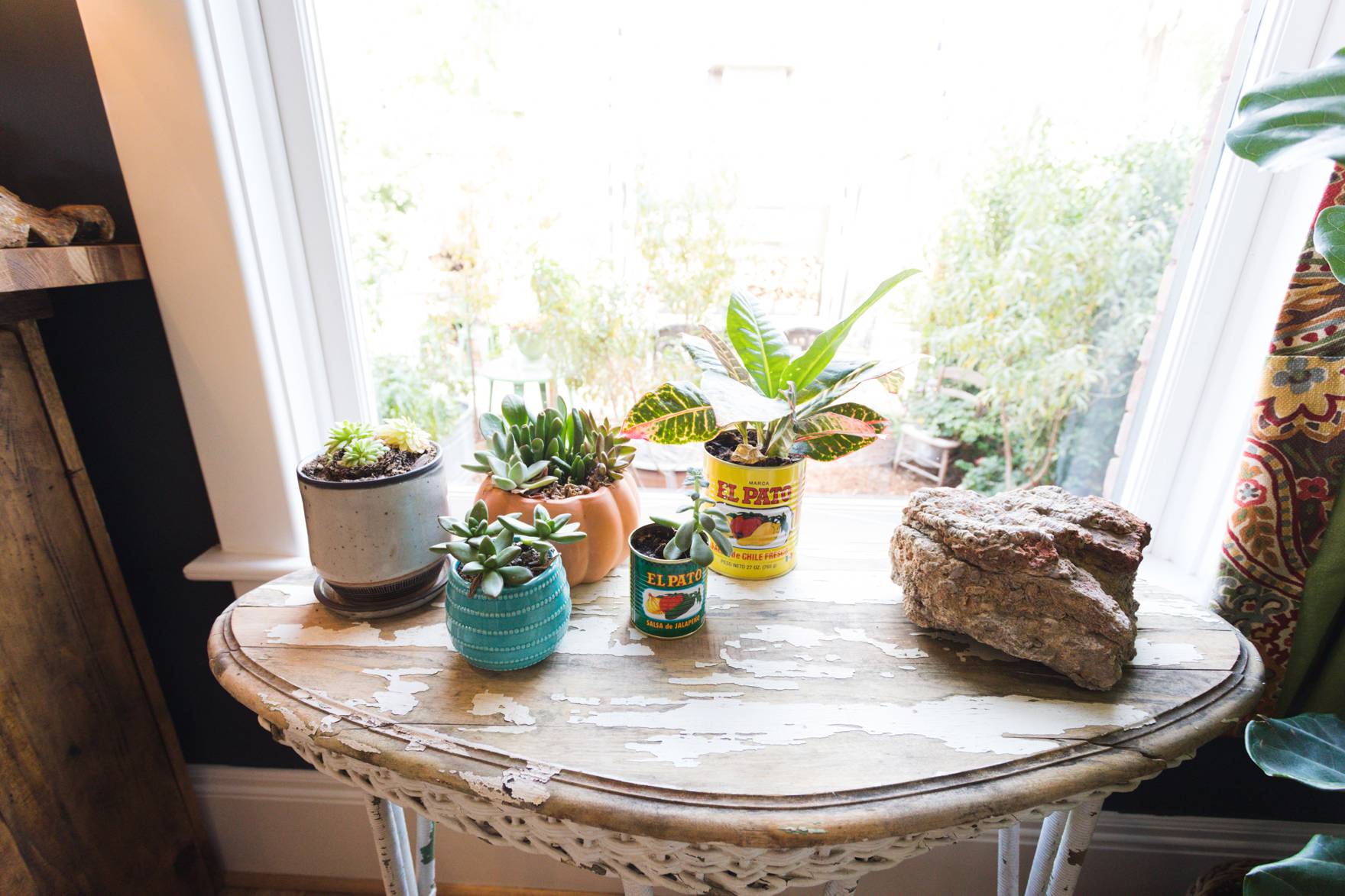 Home Tour of Boho Farm and Home in Downtown Phoenix - cottage brick style home from 1903 living room to kitchen details succulents in old sauce jars