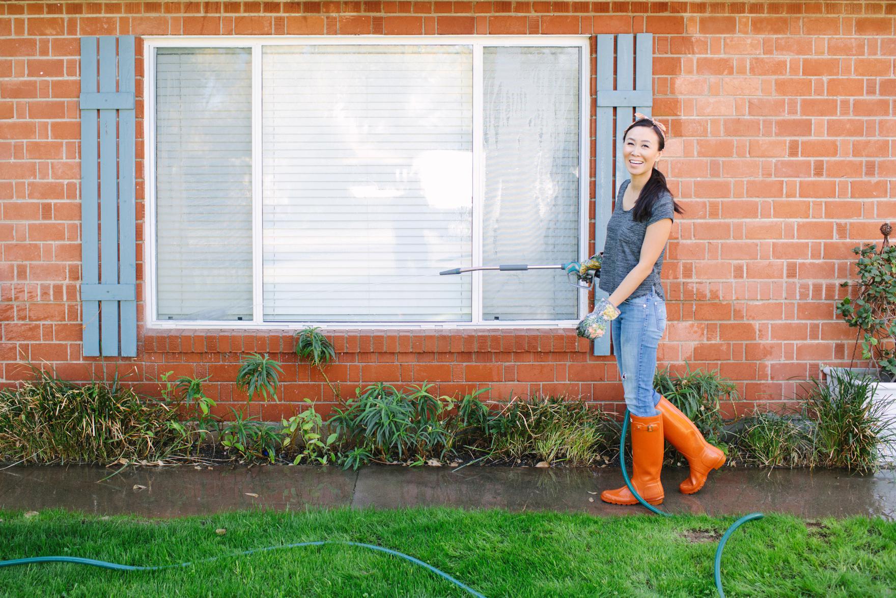 clean outside of your home windows brick stucco and concrete patio and driveway with Gilmour spray hose and pressure washer featuring Diana Elizabeth lifestyle garden blogger