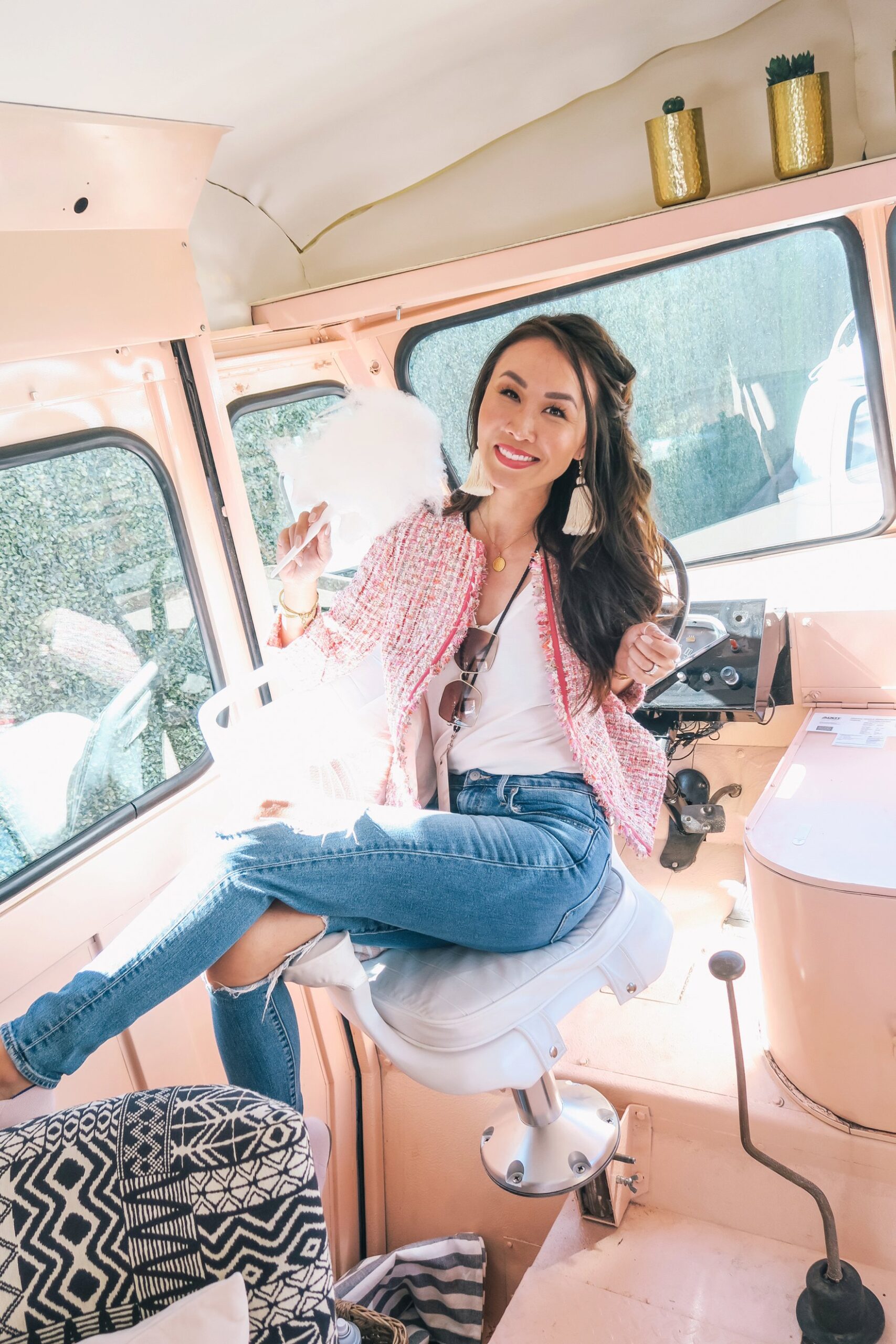 sitting in the peach az restored truck in pink boucle jacket ripped jeans and holding cotton candy // a business and blogging social media workshop called The Workshop PHX by the Bloguettes - a review.