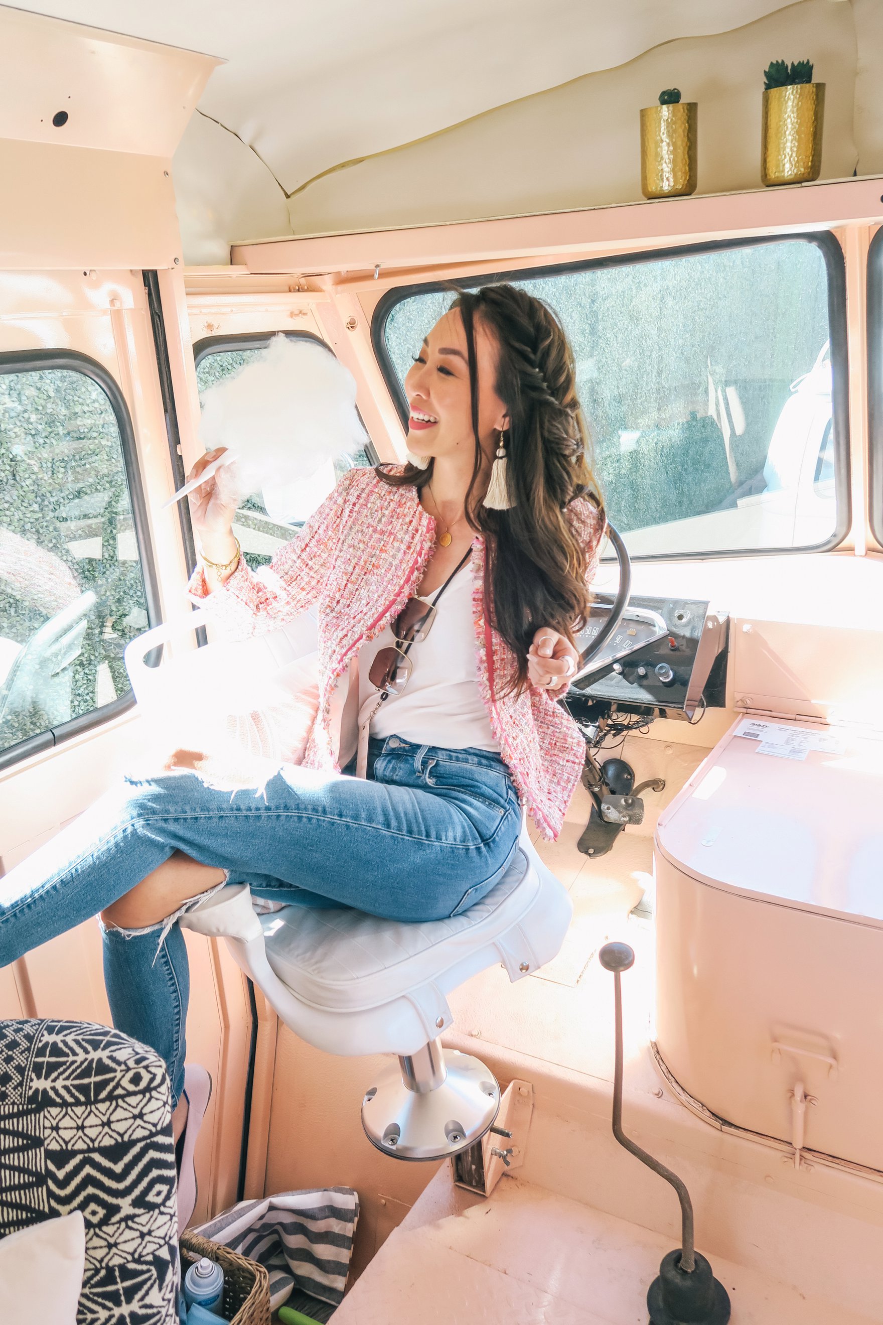 sitting in the peach az restored truck in pink boucle jacket ripped jeans and holding cotton candy // a business and blogging social media workshop called The Workshop PHX by the Bloguettes - a review.
