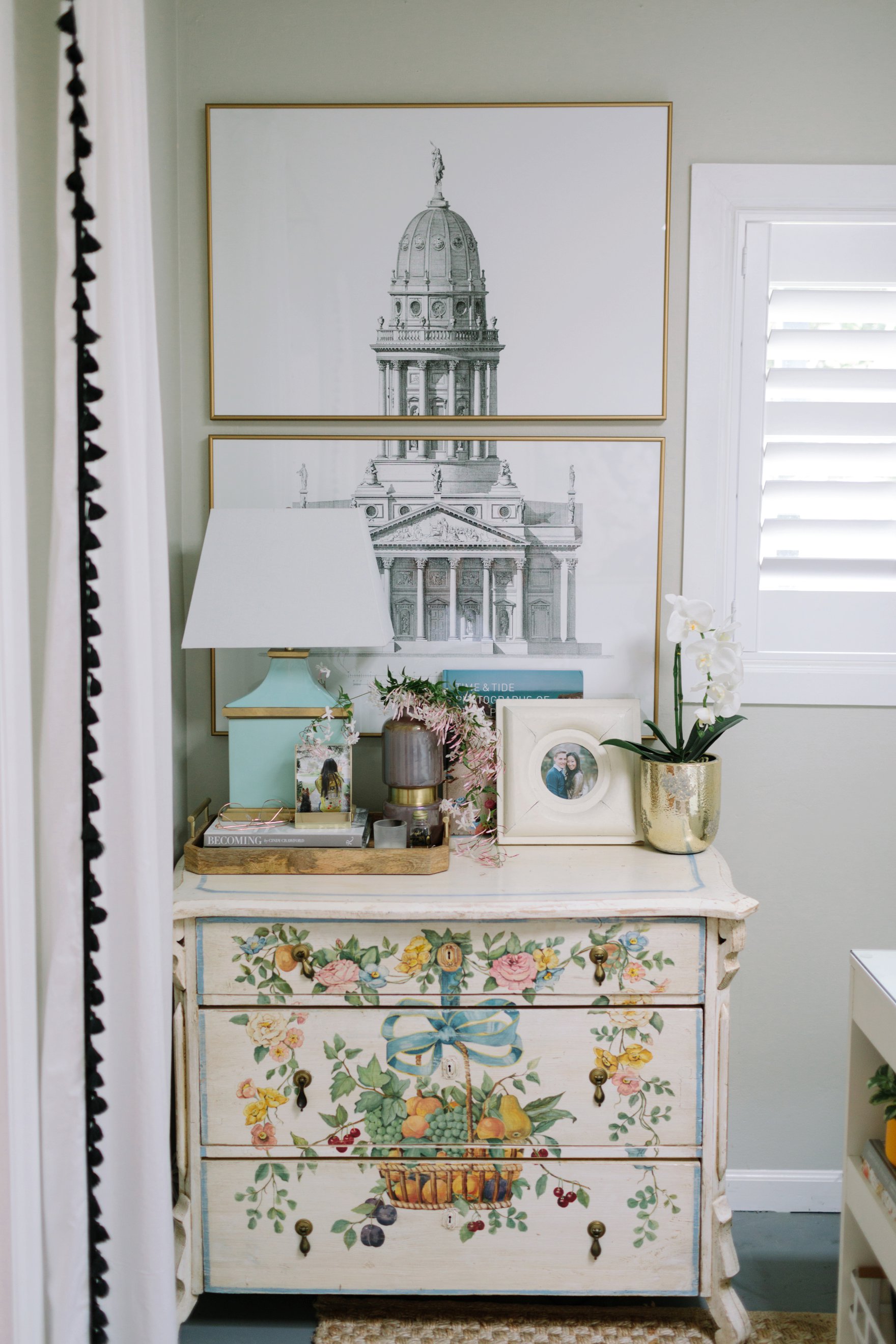 Antique English dresser featuring stacked sketch of architectural prints - blogger photographer home office