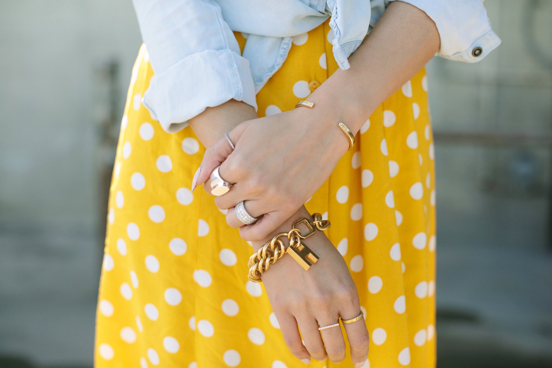 Yellow and white polka dot dress forever 21 paired with a chambray top featuring India hicks bracelet and other jewels
