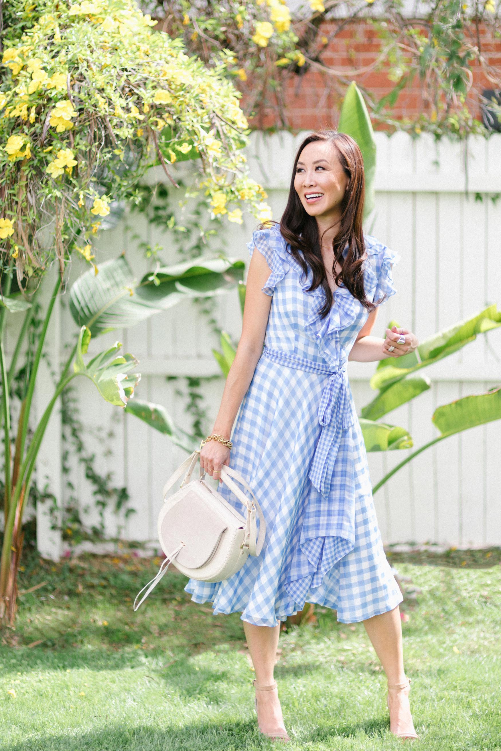 blue check ruffled gingham spring time dress by Tahari ASL // Phoenix Style Lifestyle Blogger Diana Elizabeth in front of white painted fence with yellow flowers cat's claw vines