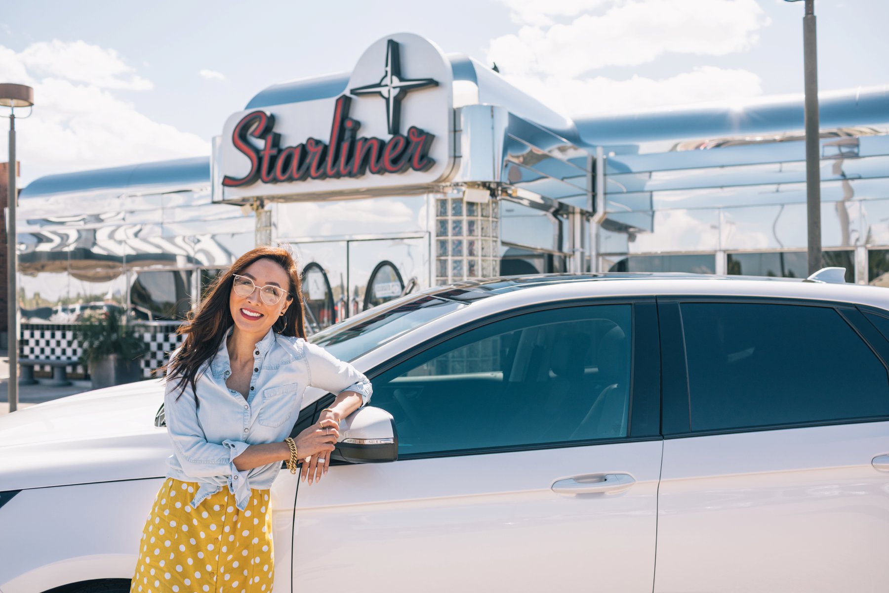 Ford Edge review with Sanderson Ford, lifestyle blogger Diana Elizabeth posing with a car