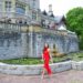 hatley castle wedding in Victoria Canada wearing a red lace dress like the emoji
