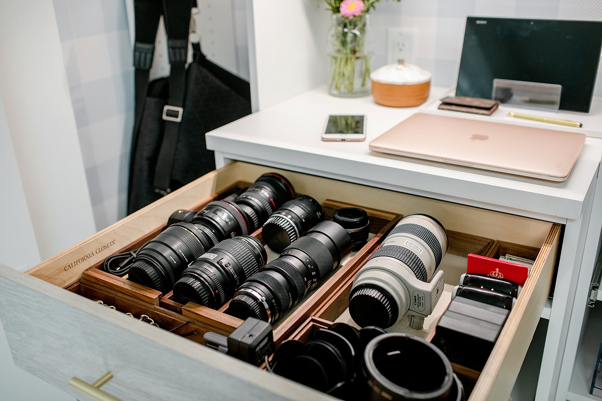lens organization and camera lens drawer: final reveal of office closet reveal belonging to photographer blogger Diana Elizabeth in phoenix arizona. created by California closets and with removable buffalo check wallpaper #office #closet #wallpaper #organization #lensorganization #lensdrawer