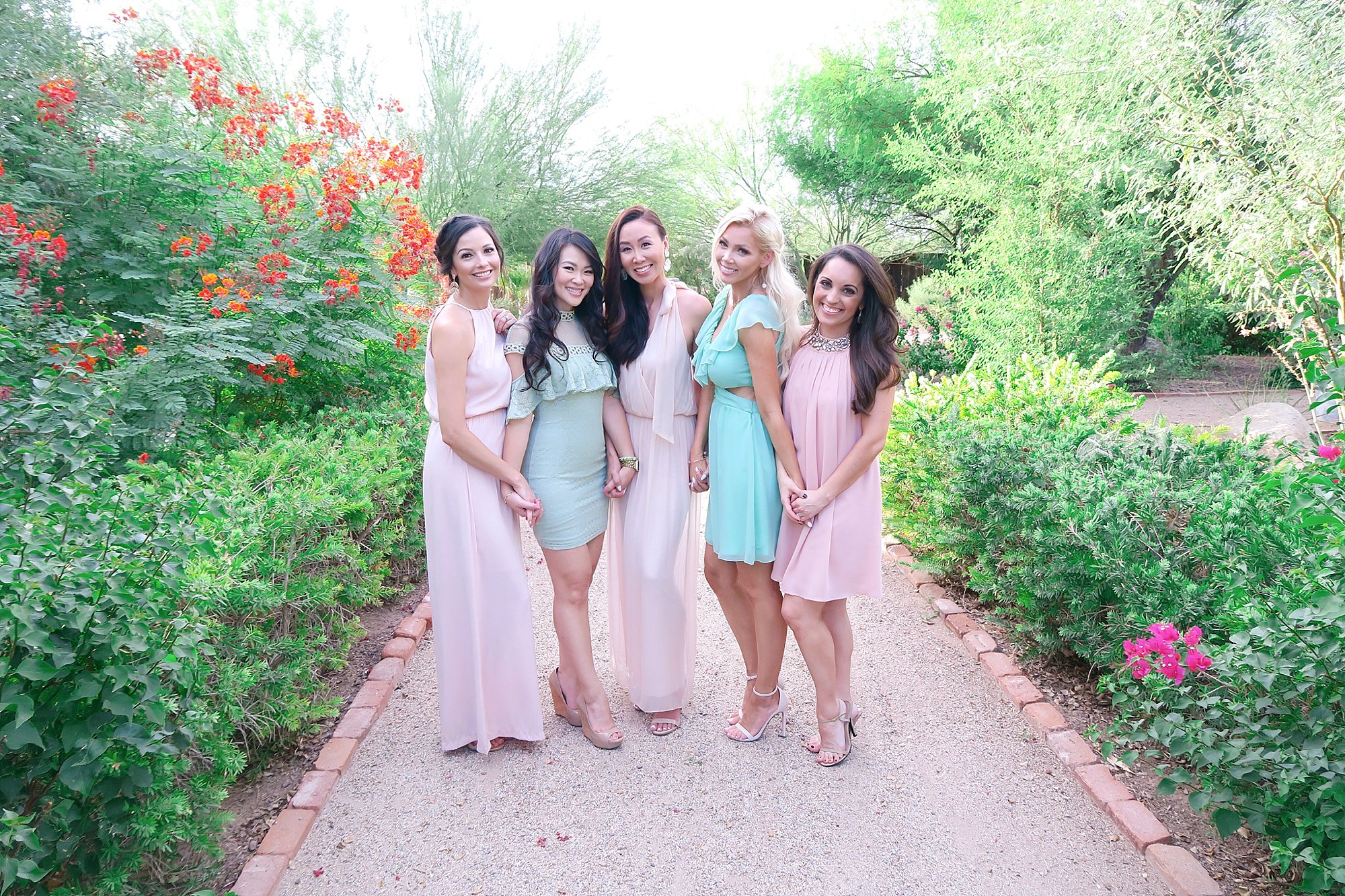 wedding guests at Florence arizona wedding windmill winery all in same colors pastel