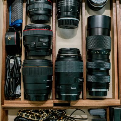 organizing lenses in a drawer. see this reveal in a photographer's home office closet and organizing camera lenses in drawers #photography #lensdrawer #lenses #organization