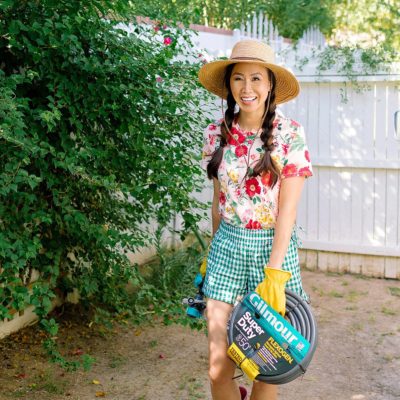FAQ on our backyard and gardening on the blog roundup post. lifestyle garden blogger Diana Elizabeth from phoenix arizona wearing floral top and gingham shorts