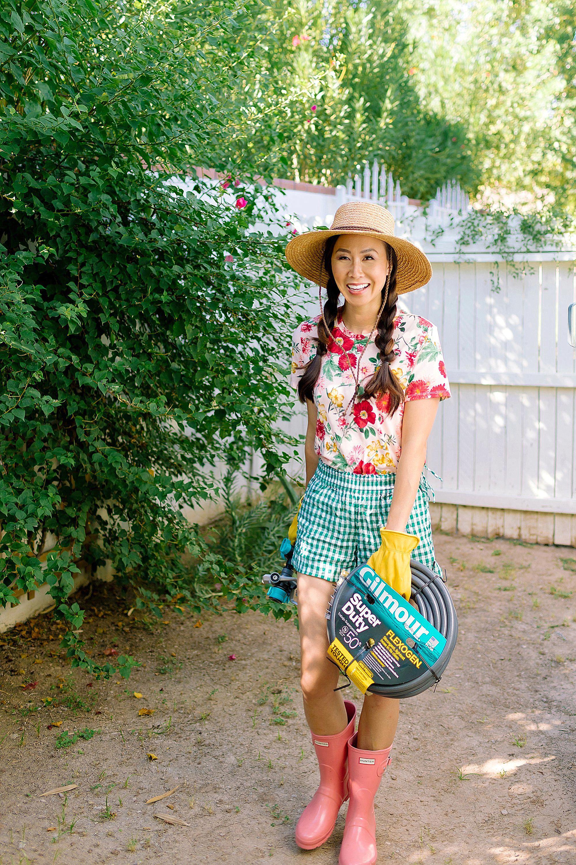 FAQ on our backyard and gardening on the blog roundup post. lifestyle garden blogger Diana Elizabeth from phoenix arizona wearing floral top and gingham shorts