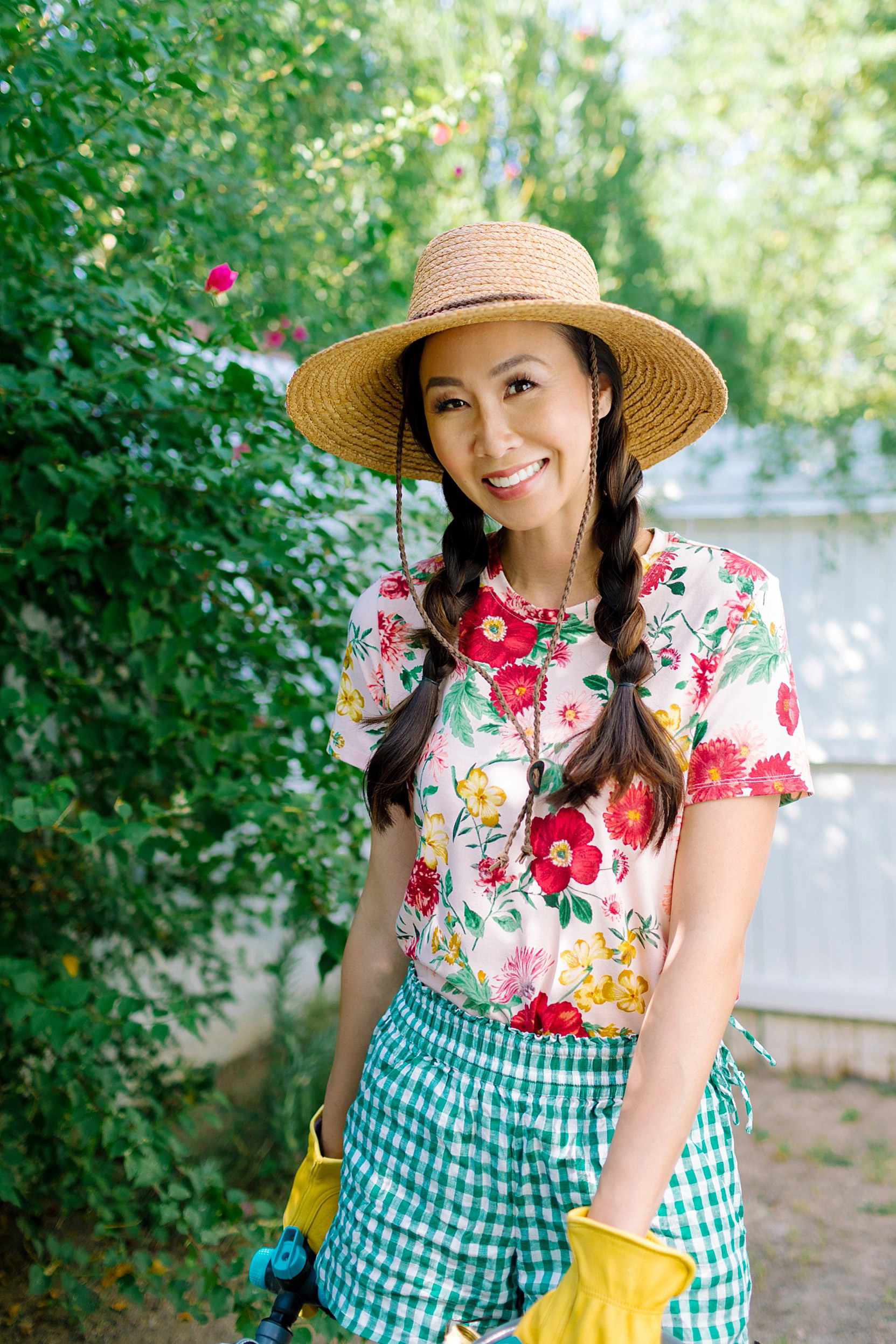 fAQ about starting a garden Garden preparation with Fiskars and Gilmour flexogen hose with tool shed tour garden lifestyle blogger Diana Elizabeth phoenix arizona wearing floral shirt and gingham shorts