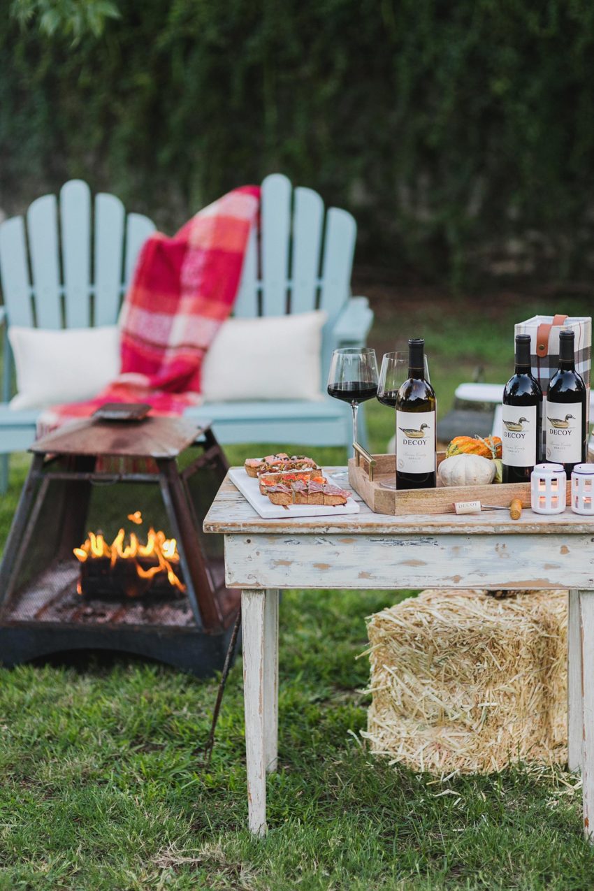backyard fall party with wine and fall colors merlot decoy wine fire pit glowing