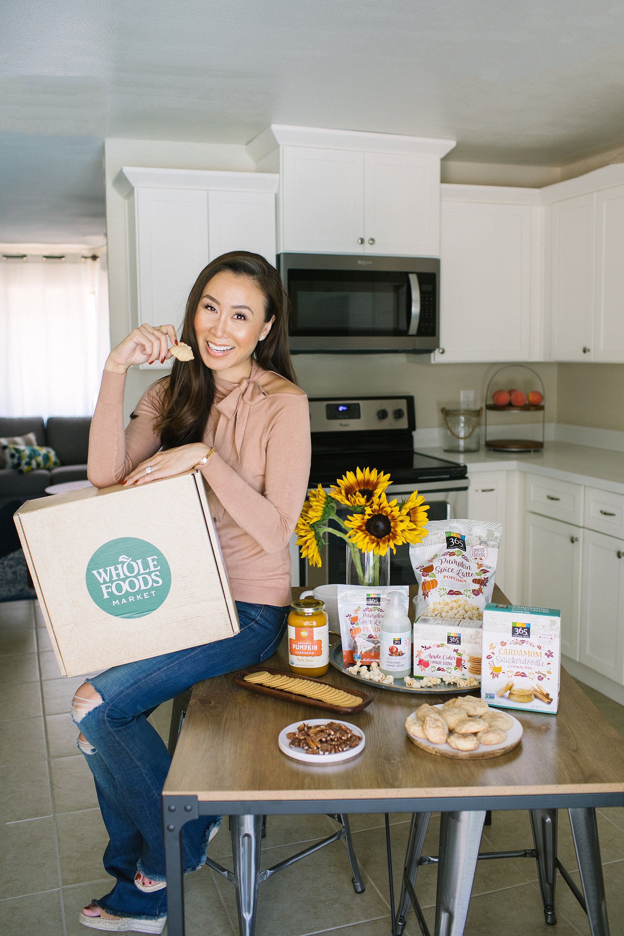 Whole Foods giveaway of best fall flavors, lifestyle blogger Diana Elizabeth in Phoenix arizona holding Whole Foods box with cookie she made