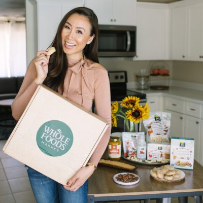 Whole Foods giveaway of best fall flavors, lifestyle blogger Diana Elizabeth in Phoenix arizona holding Whole Foods box with cookie she made