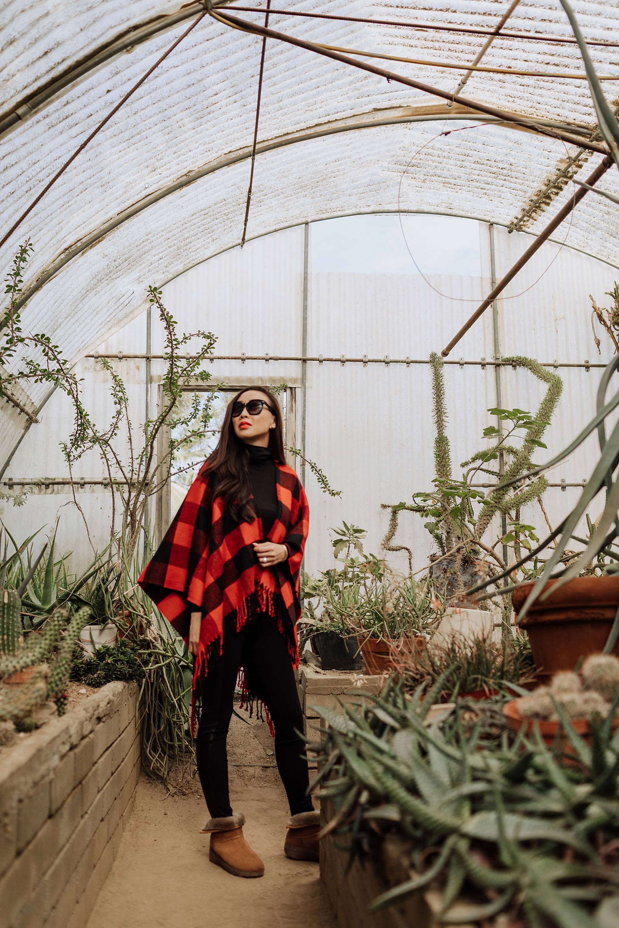 Moorten Botanical Garden Palm Springs cactus garden outdoor buffalo check poncho Abercrombie on phoenix travel and lifestyle blogger Diana Elizabeth wearing cozy shearling boots by FitFlop #cactusgarden #palmsprings #greenhouse