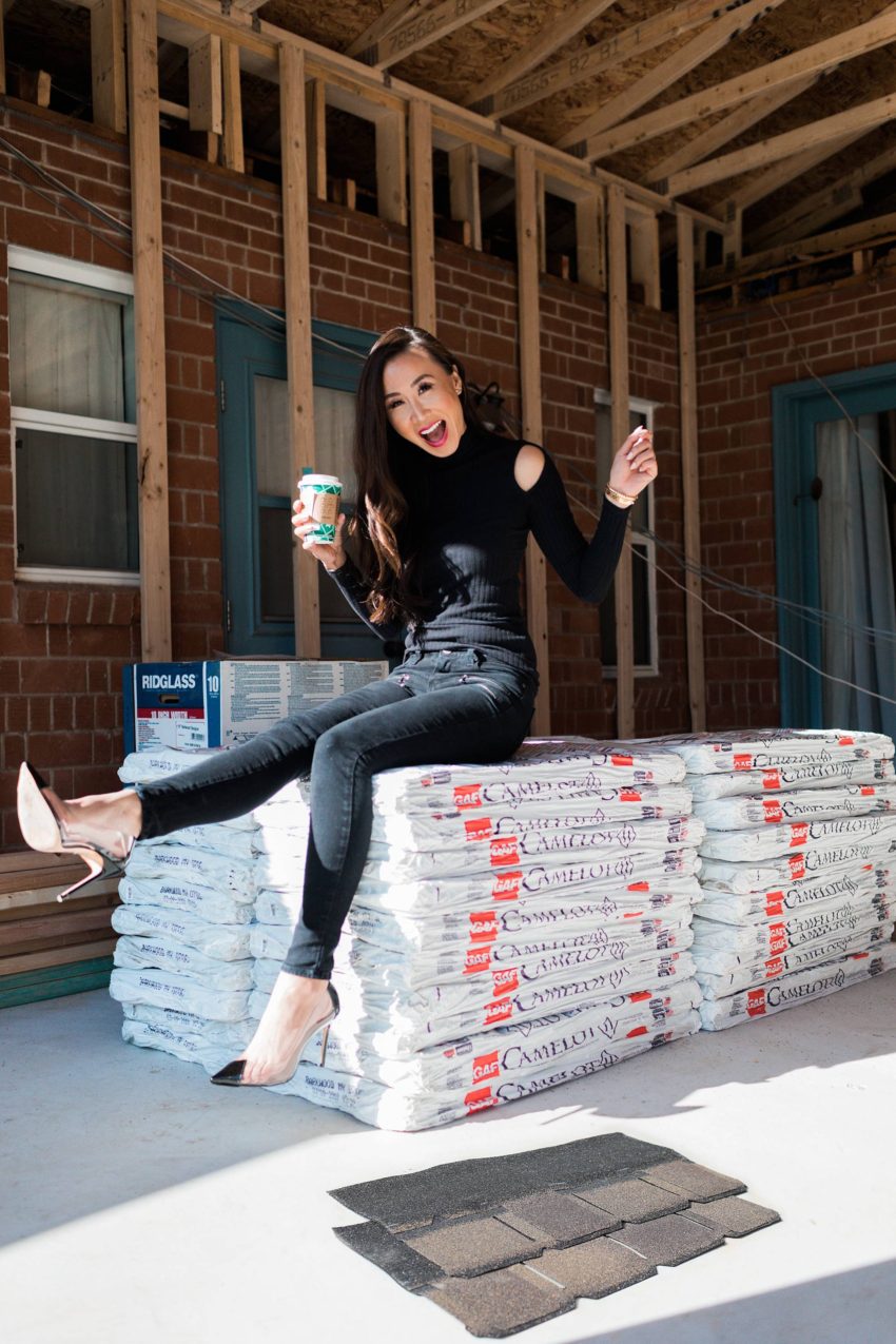 GAF roofing Camelot II designer shingles in Barkwood on lifestyle home blogger Diana Elizabeth sitting on the special delivery of roof shingles!