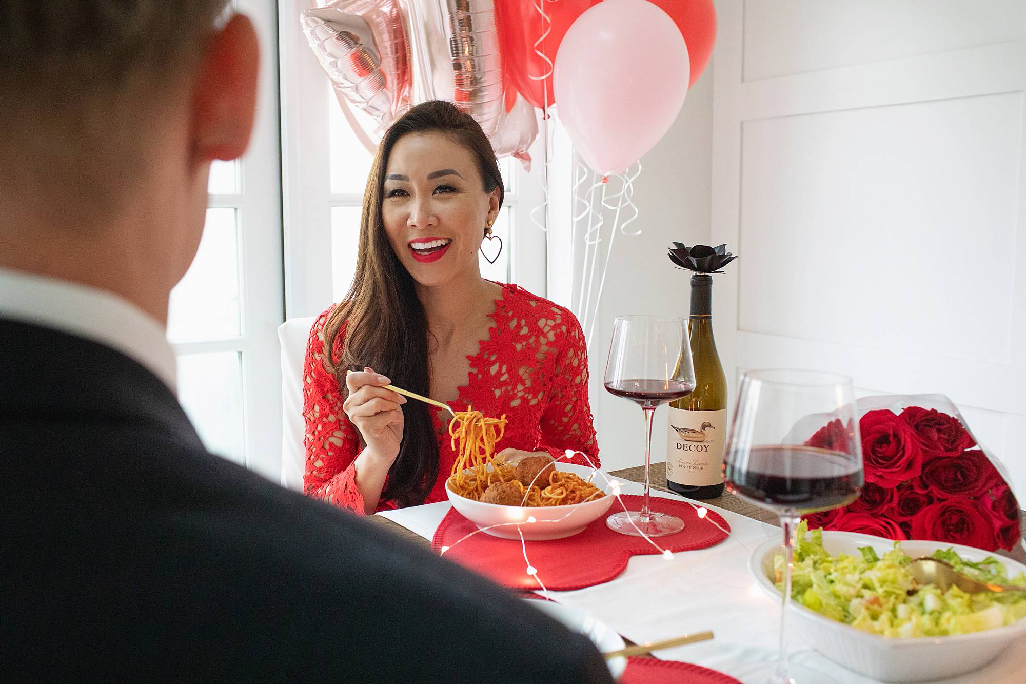 romantic valentines day dinner with decoy wine red lace dress