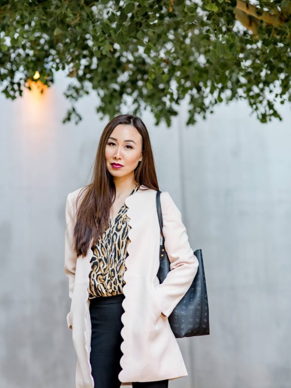 scalloped pink lightweight coat with leopard print bodysuit, clear pump heels and India Hicks tote on lifestyle blogger Diana Elizabeth in phoenix arizona