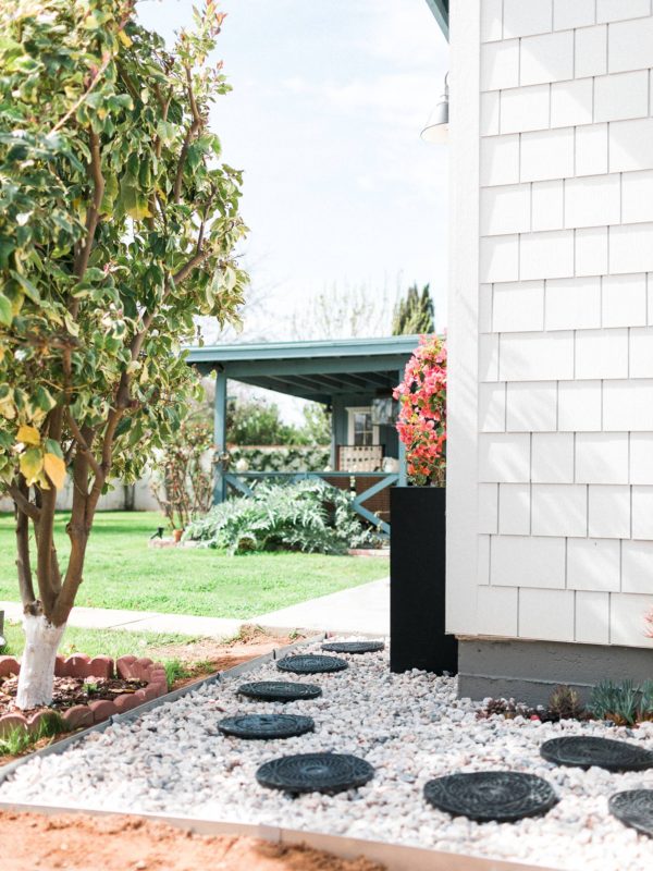 make a rocky drainage path for areas that get muddy by the hose or in the garden - a DIY how too. Alabaster white sherwin Williams white fiber cement shake shingles for siding, restoration hardware lights