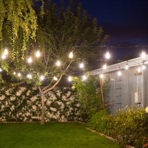 how to hang cafe string lights on cable wire in backyard - easy DIY and all the materials you need