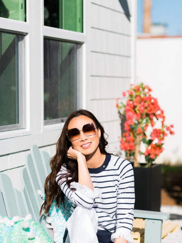 Lilly Pulitzer Dasha Sweater blue and white stripe with fringe on blogger Diana Elizabeth on bench