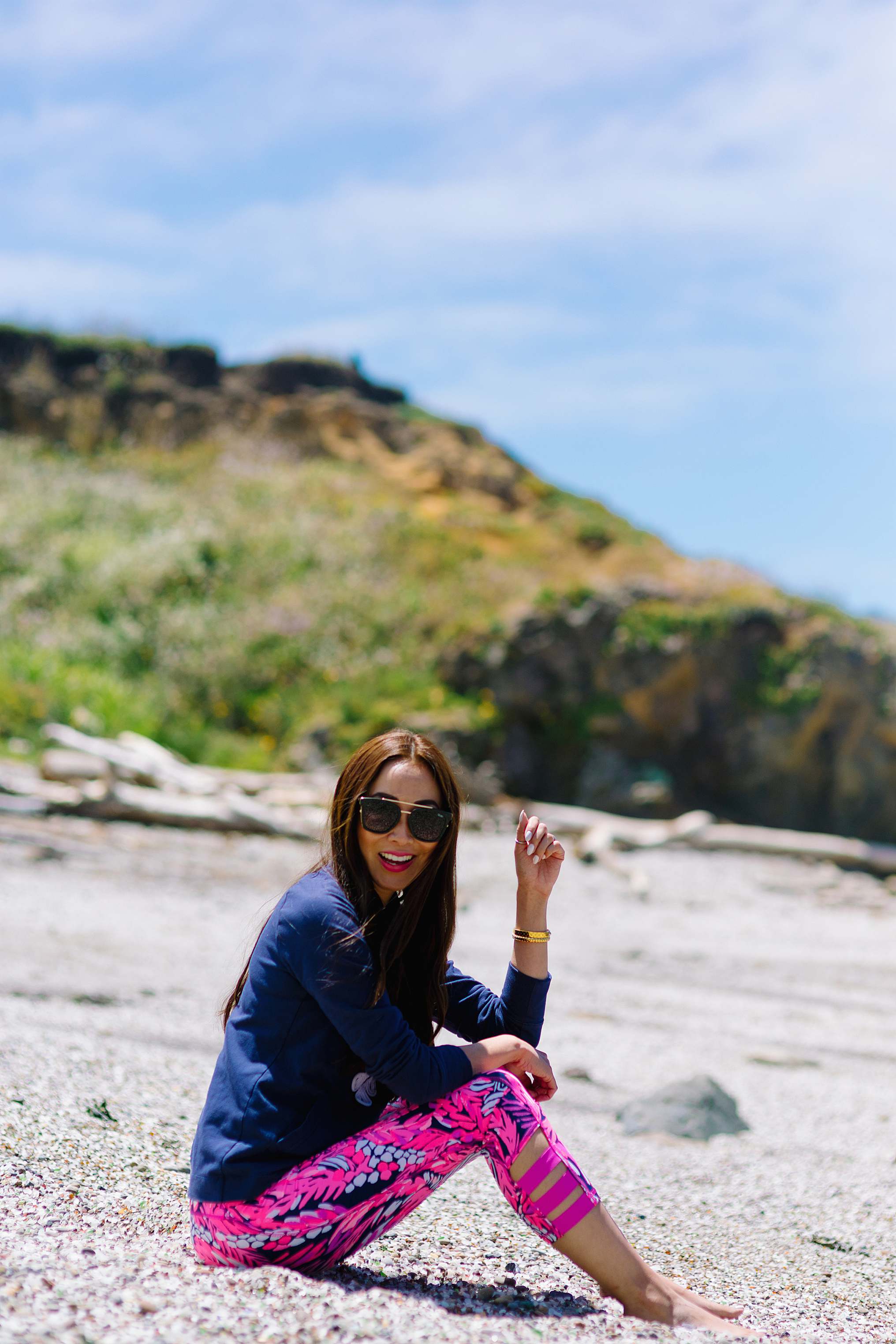 Diana Elizabeth blogger in Lilly pulitizer siting on glass beach in California Fort Bragg