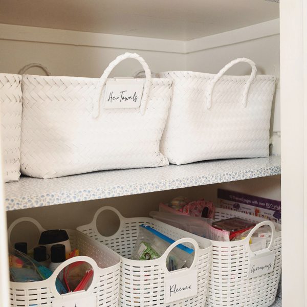 white baskets linen closet