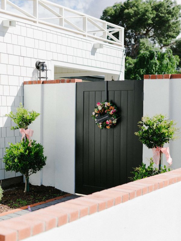 black side gate with floral spring wreath - arizona lifestyle blogger home and garden blog