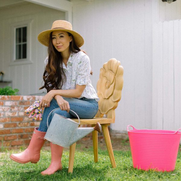 teak floral chair rose poppy gardener's backyard, garden lifestyle blogger Diana Elizabeth in garden hat, gloves and old watering can