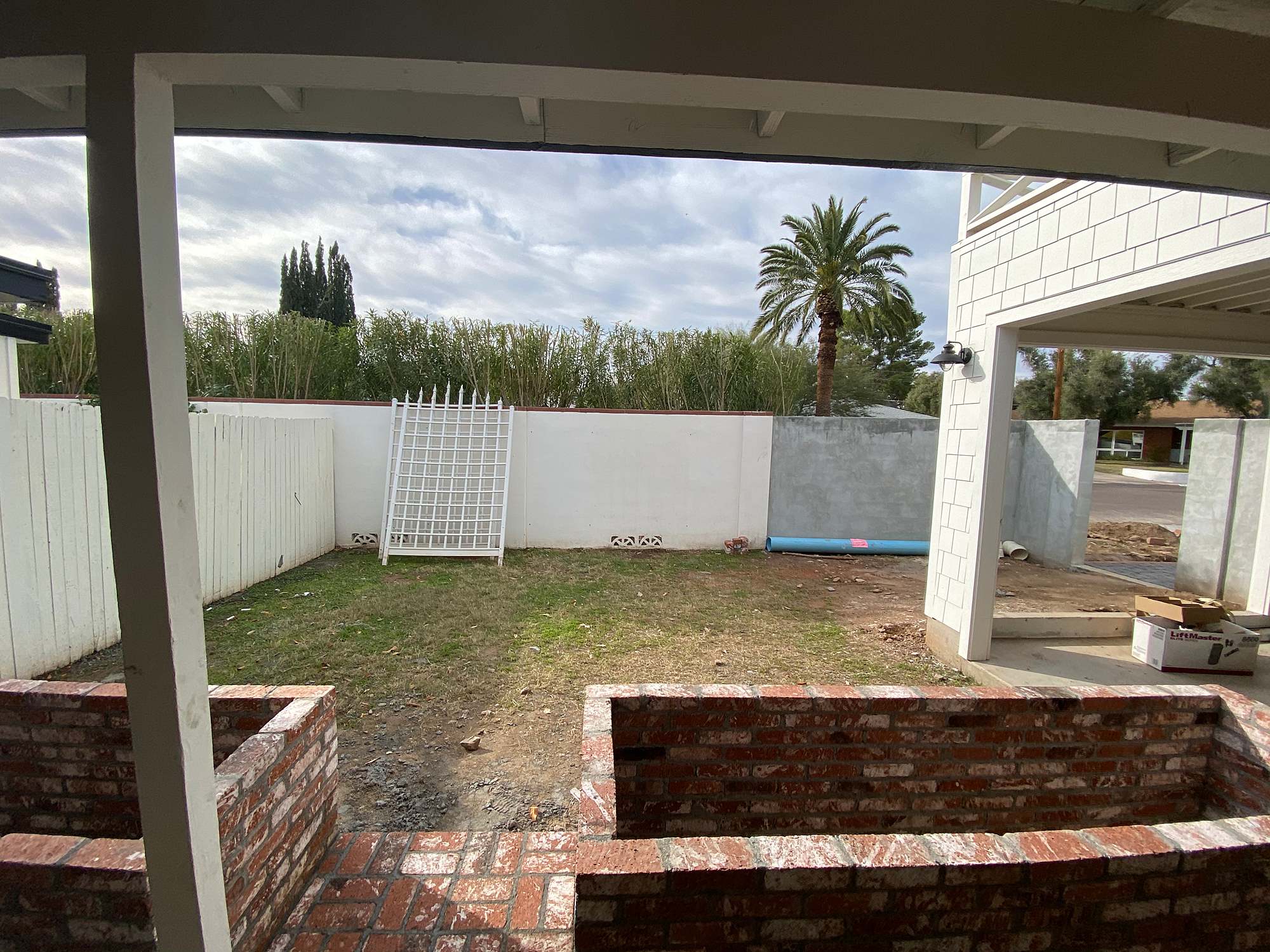 adding on to the cinderblock wall to make the new garden area - see the blog post for the after progression photos #homeimprovement #garden