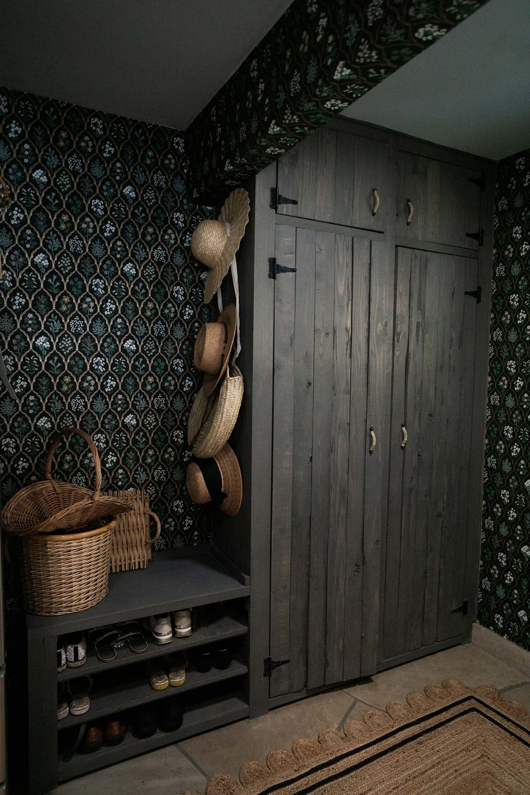 English Countryside Inspired Laundry Mud Room with Dark Wallpaper