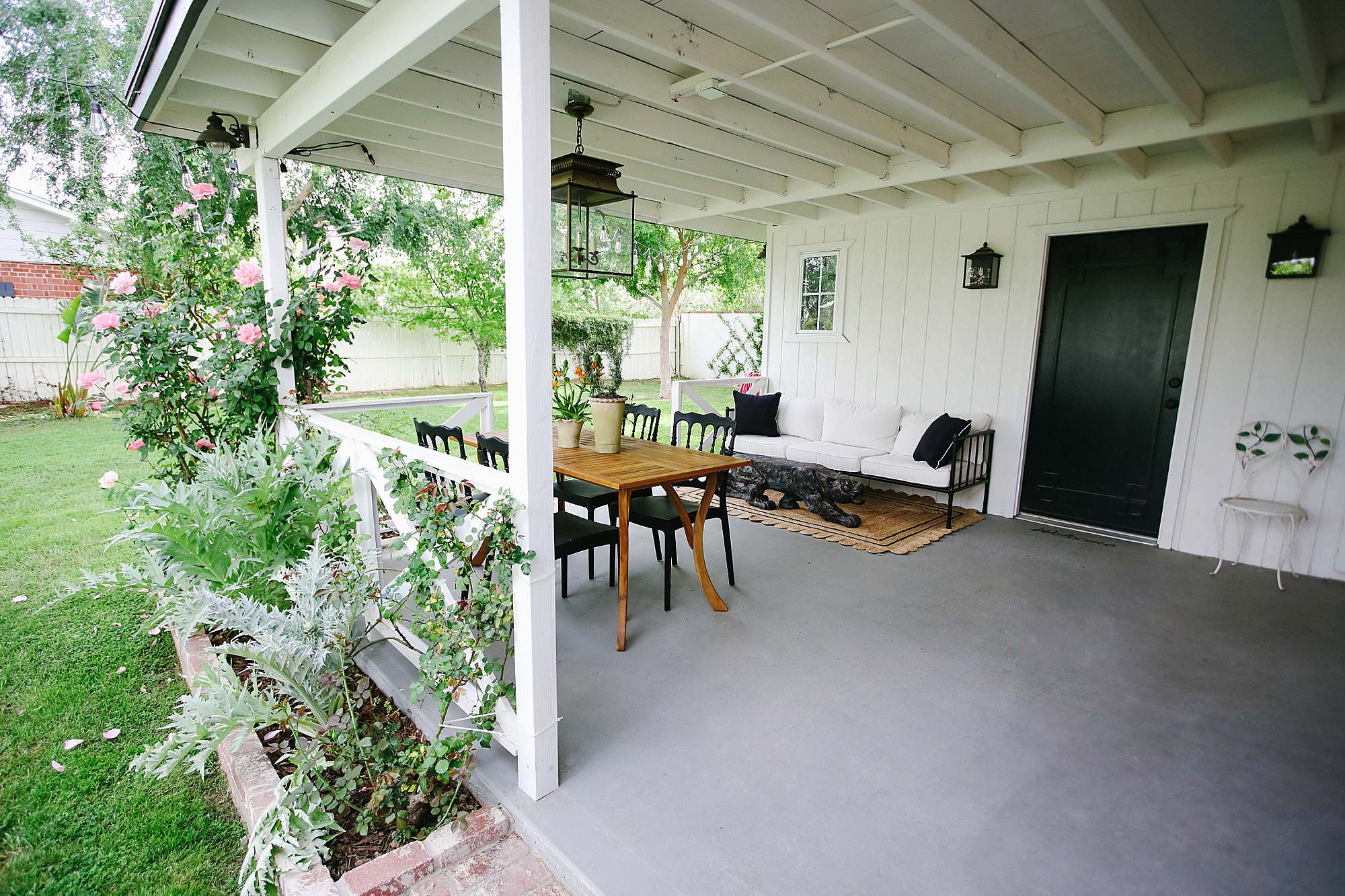 Grandmillennial style porch inspiration contemporary English garden white and black romantic feminine backyard porch vibe