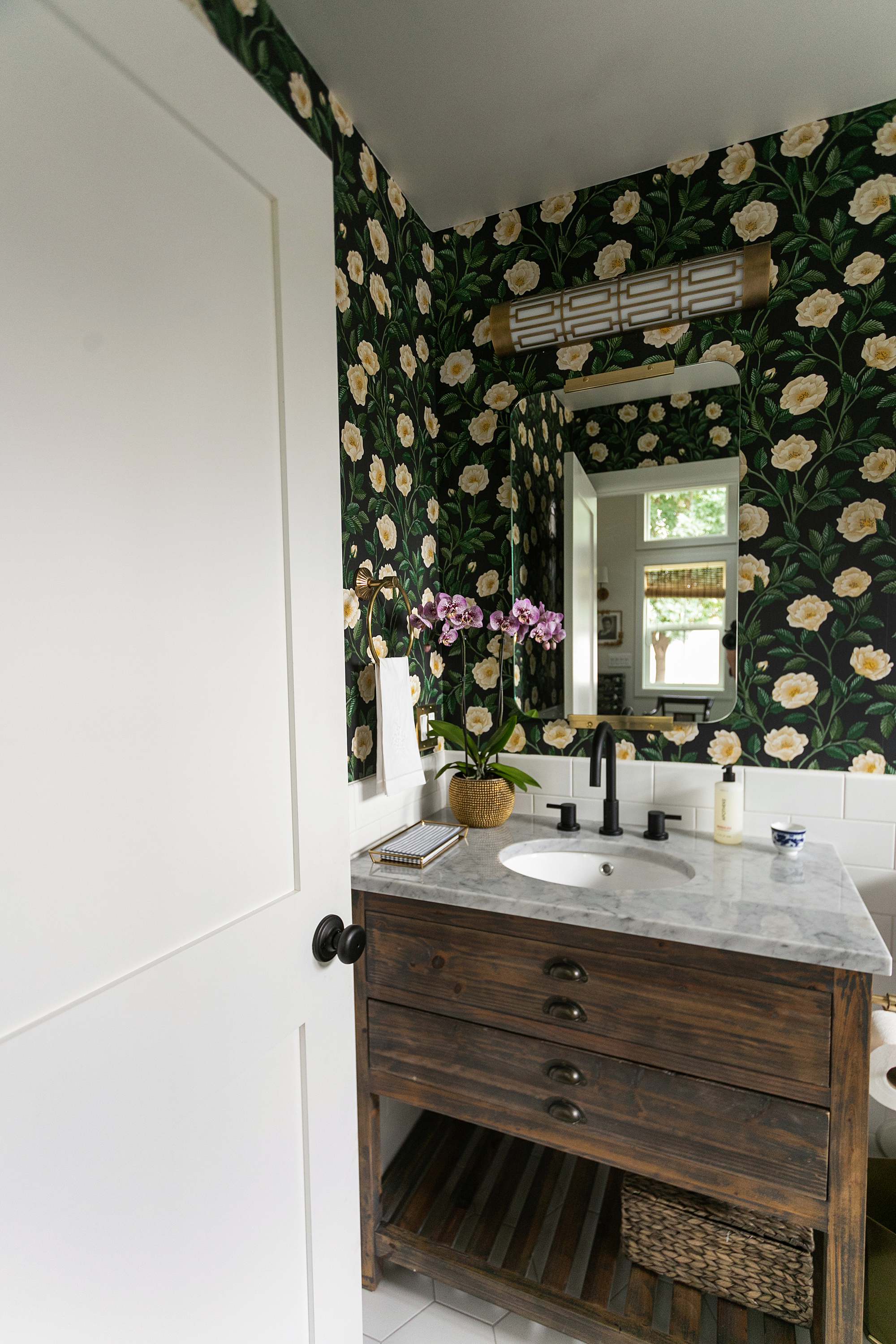 Cole and sons rose wallpaper dark floral wallpaper in powder room - how to make a guest bathroom unique and special