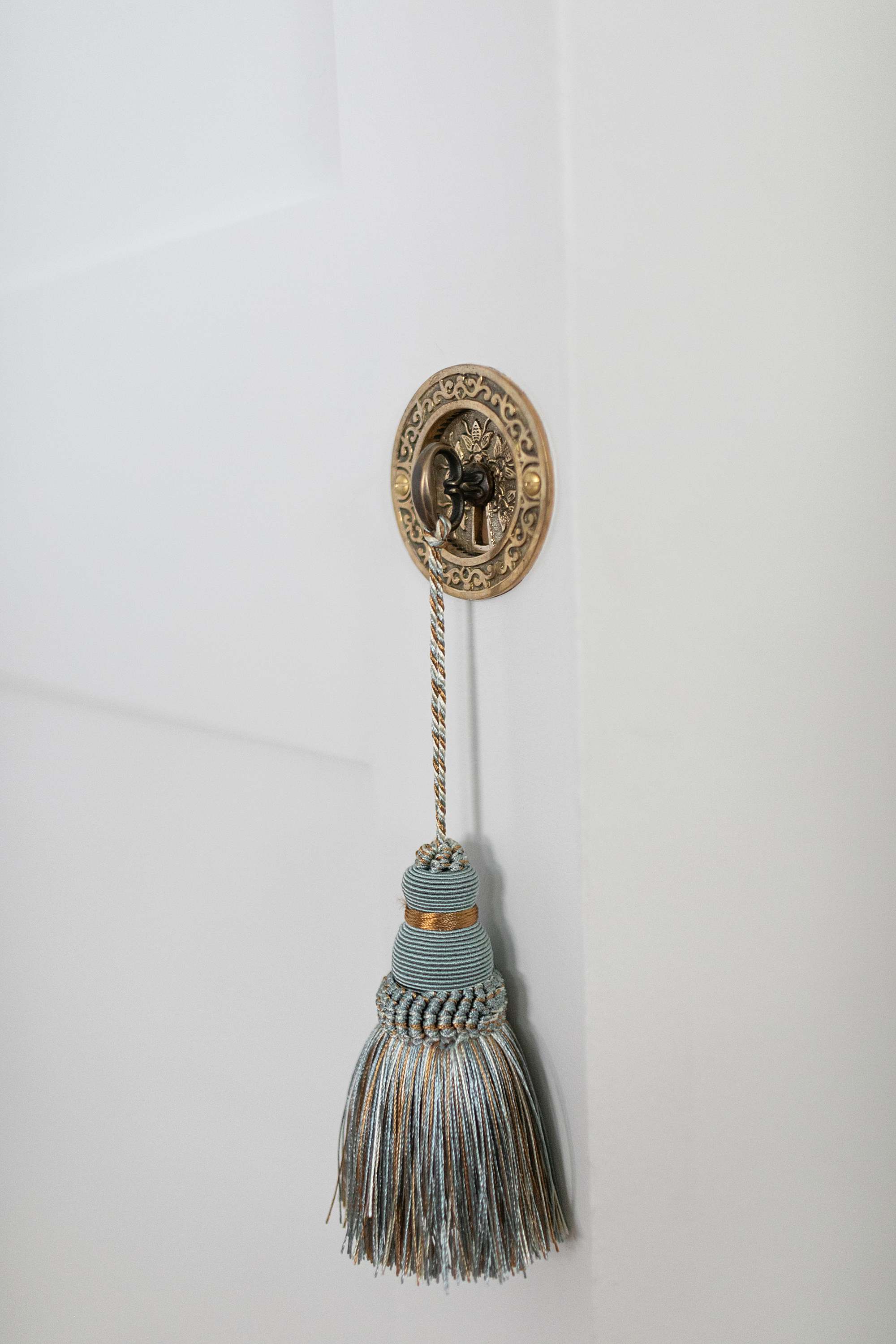 tassel on faux key harmon hinge door detail knob