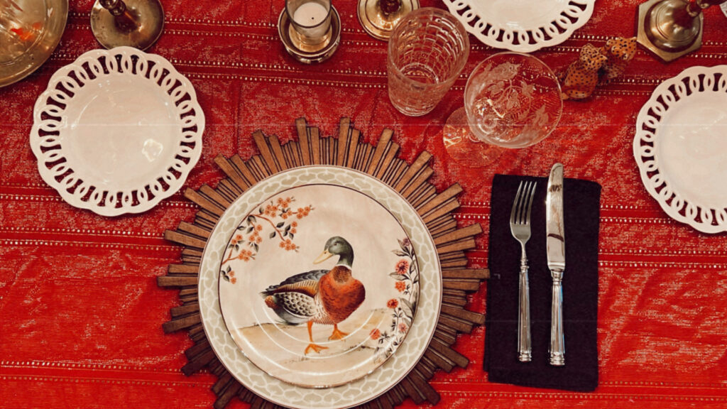 christmas table scape dinner setting with friends, bird plates from Pottery Barn
