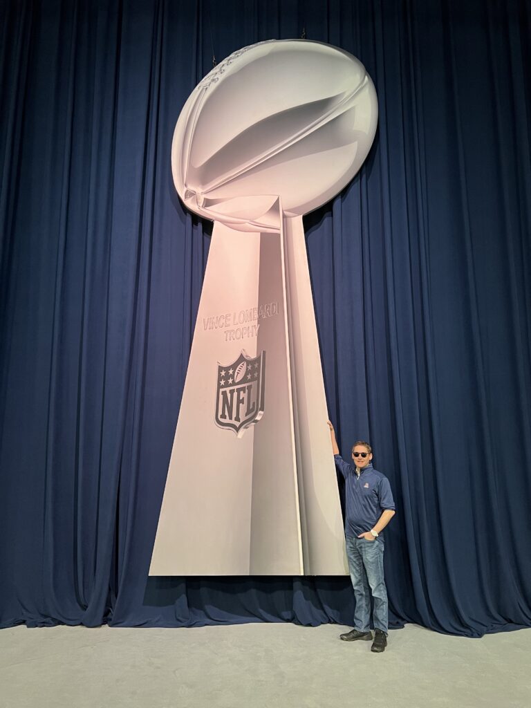 vince lombardi trophy large cut out at super bowl experience