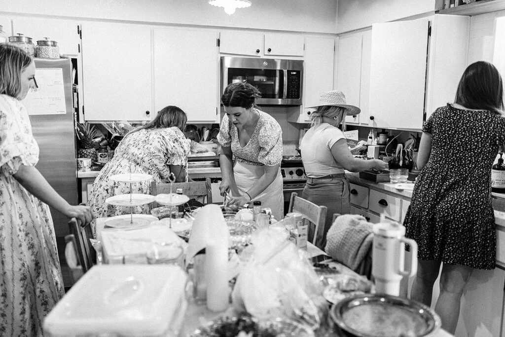 so many friends in the kitchen helping prepare coastal grandmother party tea party baby shower afternoon tea blue and white