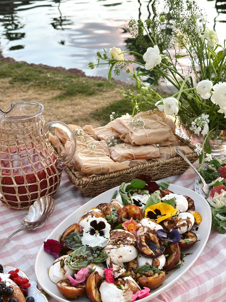 picnic by the lake inspiration with friends plan a picnic design tablescape table setting ideas picnic